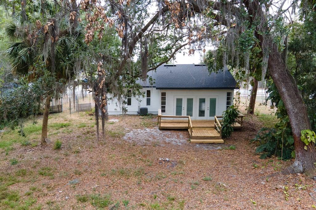 6345 Hatcher Road Lakeland, FL 33811 - Photo 35 of 41 a view of house with a garden and trees