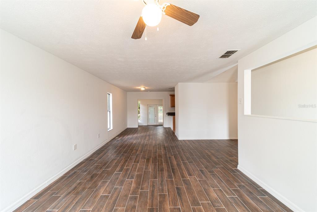 6345 Hatcher Road Lakeland, FL 33811 - Photo 37 of 41 a view of a room with wooden floor and white walls