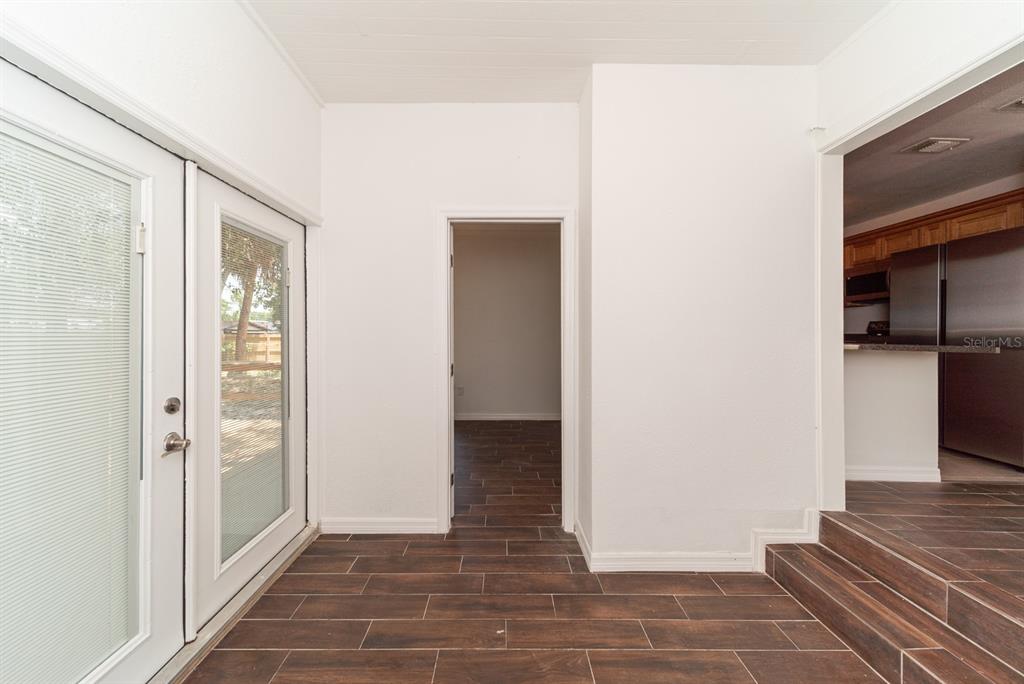 6345 Hatcher Road Lakeland, FL 33811 - Photo 41 of 41 a view of a hallway with wooden floor and staircase