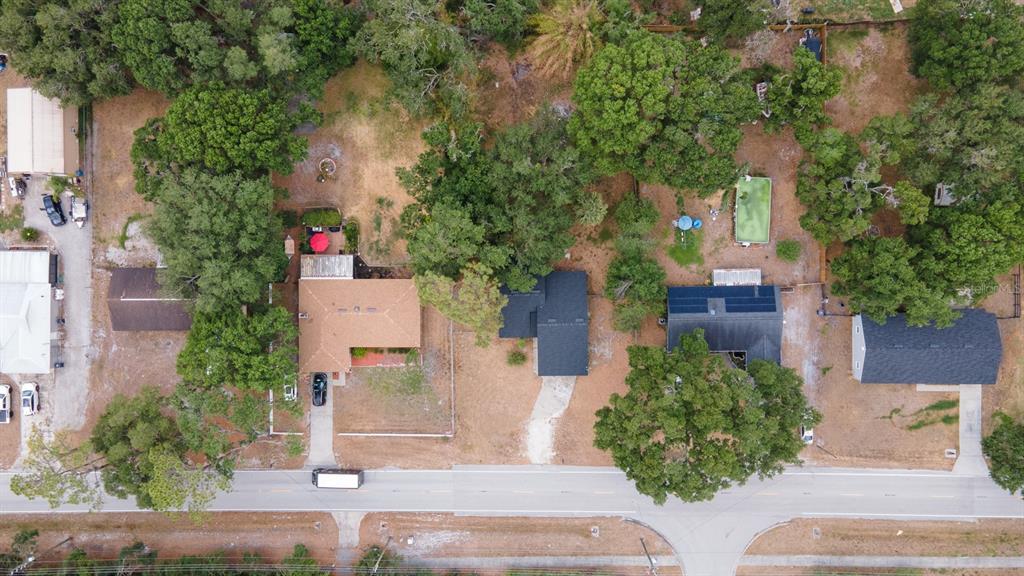 6345 Hatcher Road Lakeland, FL 33811 - Photo 8 of 41 an aerial view of a house with a yard and potted plants