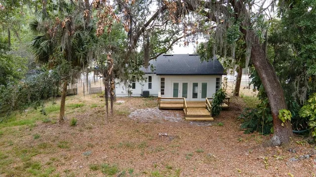 a house that has tree in front of it