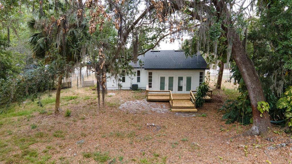 6345 Hatcher Road Lakeland, FL 33811 - Photo 9 of 41 a house that has tree in front of it