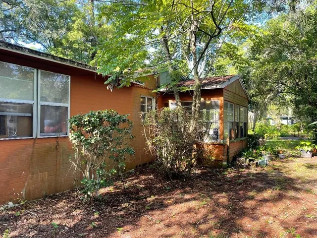 a view of a house with a tree