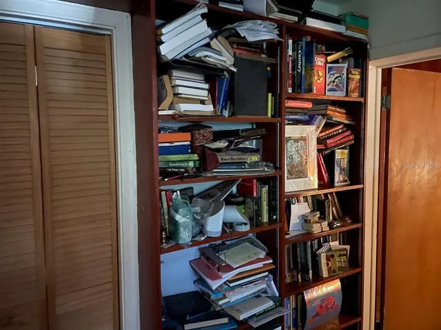 a room with lots of chairs and wooden floor
