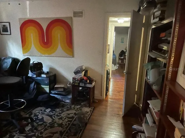 a room with furniture and musical instruments