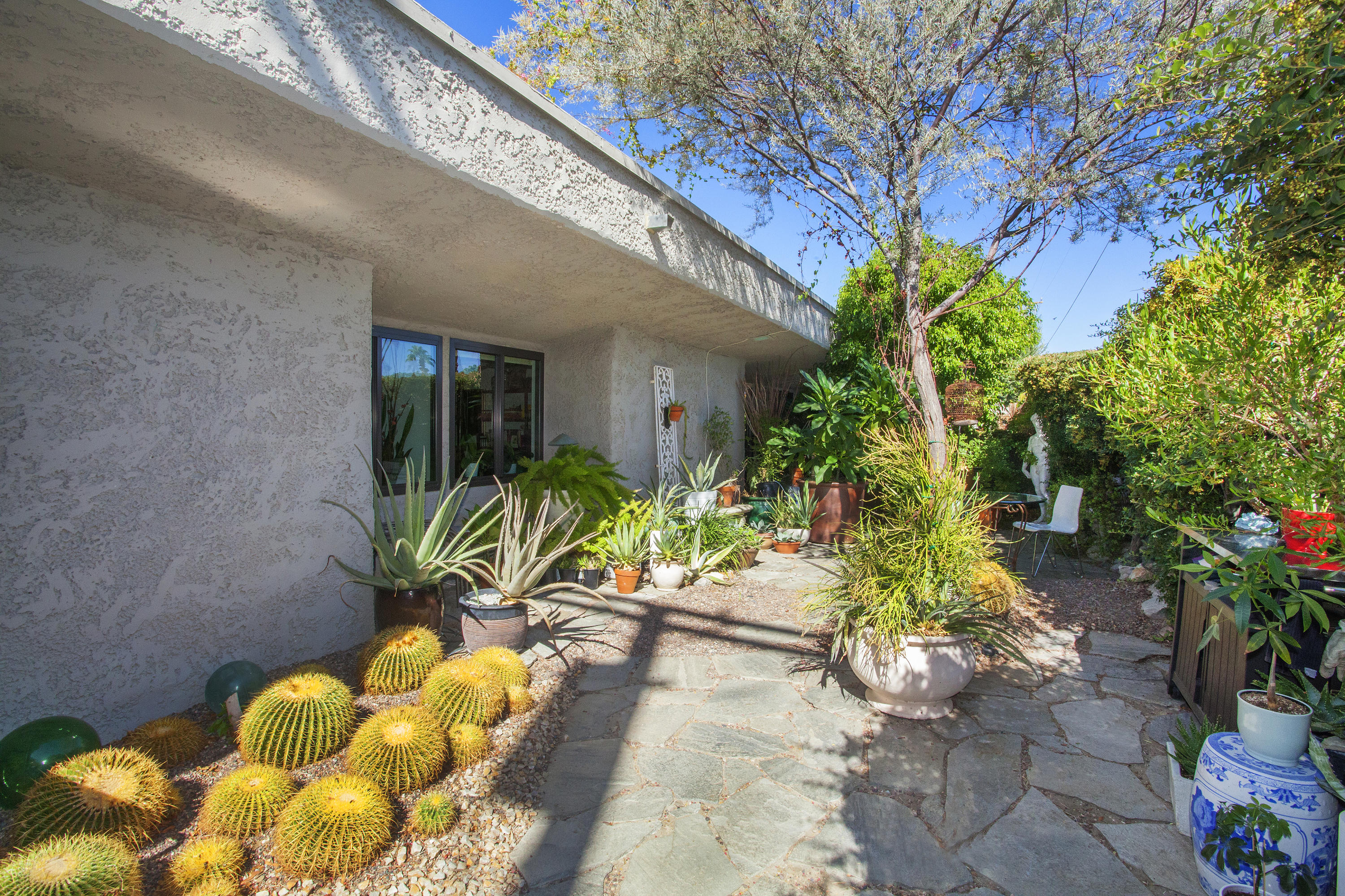 1111 Ramon Road, Unit 88 Palm Springs, CA 92264 - Photo 12 of 24 a view of entryway with flower pots