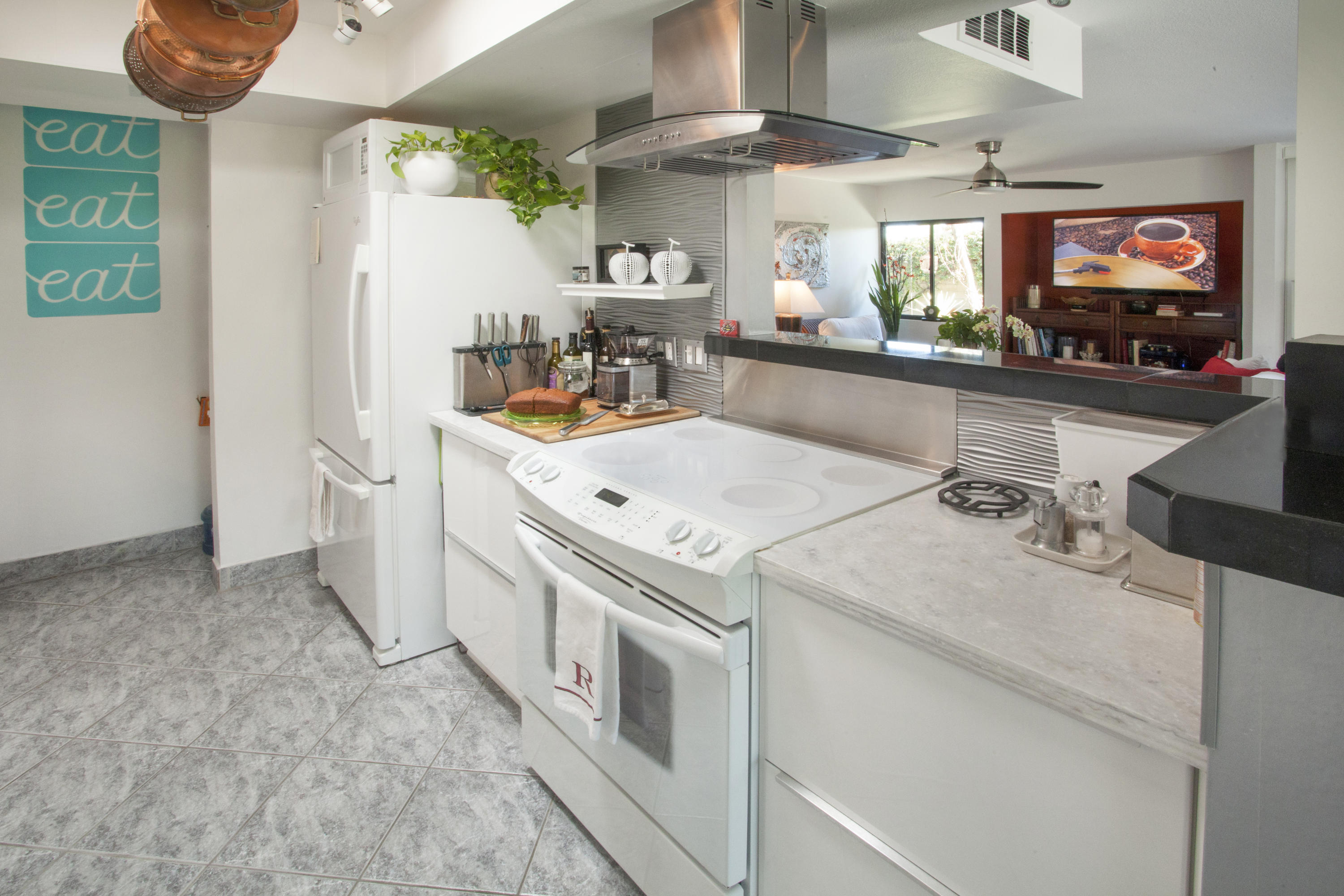1111 Ramon Road, Unit 88 Palm Springs, CA 92264 - Photo 15 of 24 a view of a kitchen with a sink and a refrigerator