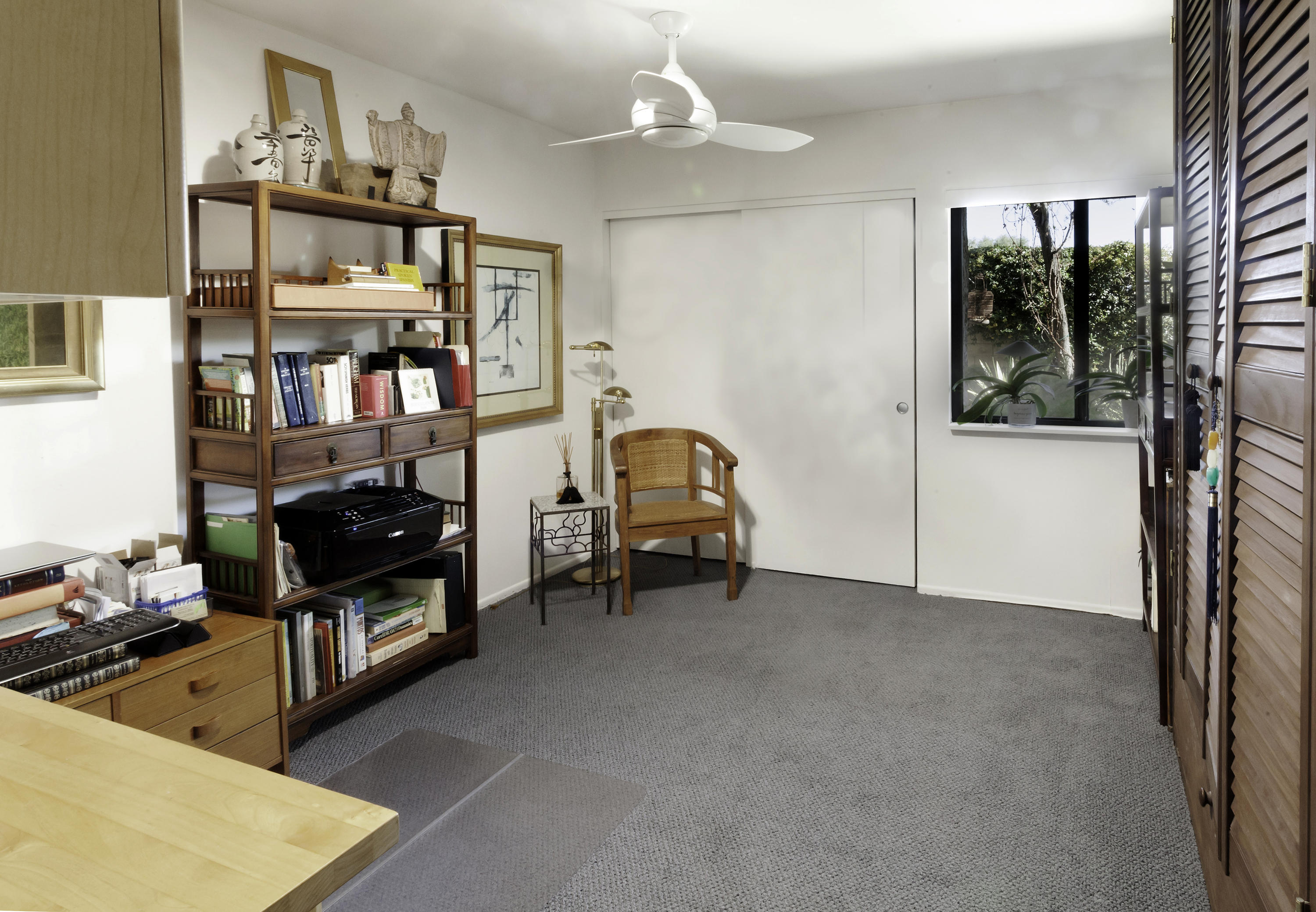1111 Ramon Road, Unit 88 Palm Springs, CA 92264 - Photo 16 of 24 a room with furniture and a book shelf