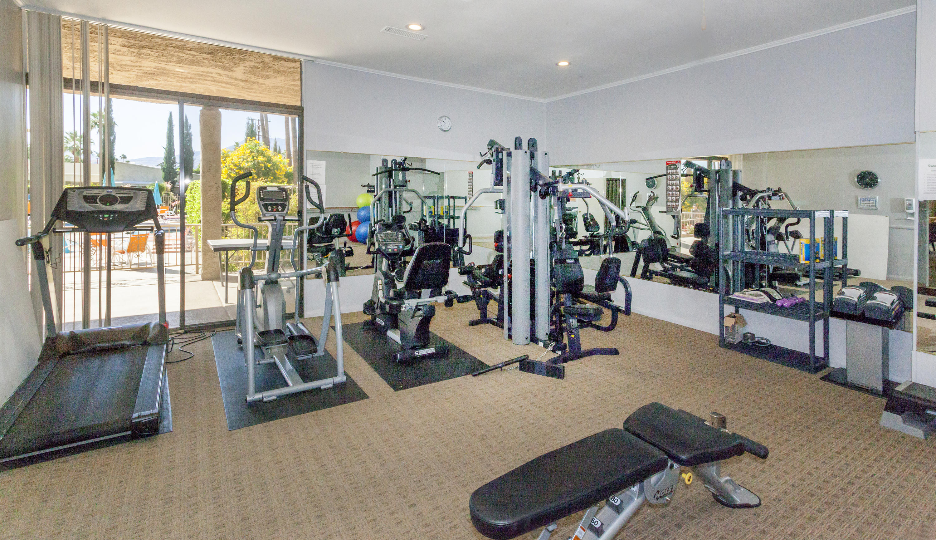 1111 Ramon Road, Unit 88 Palm Springs, CA 92264 - Photo 20 of 24 a view of a room with gym equipment