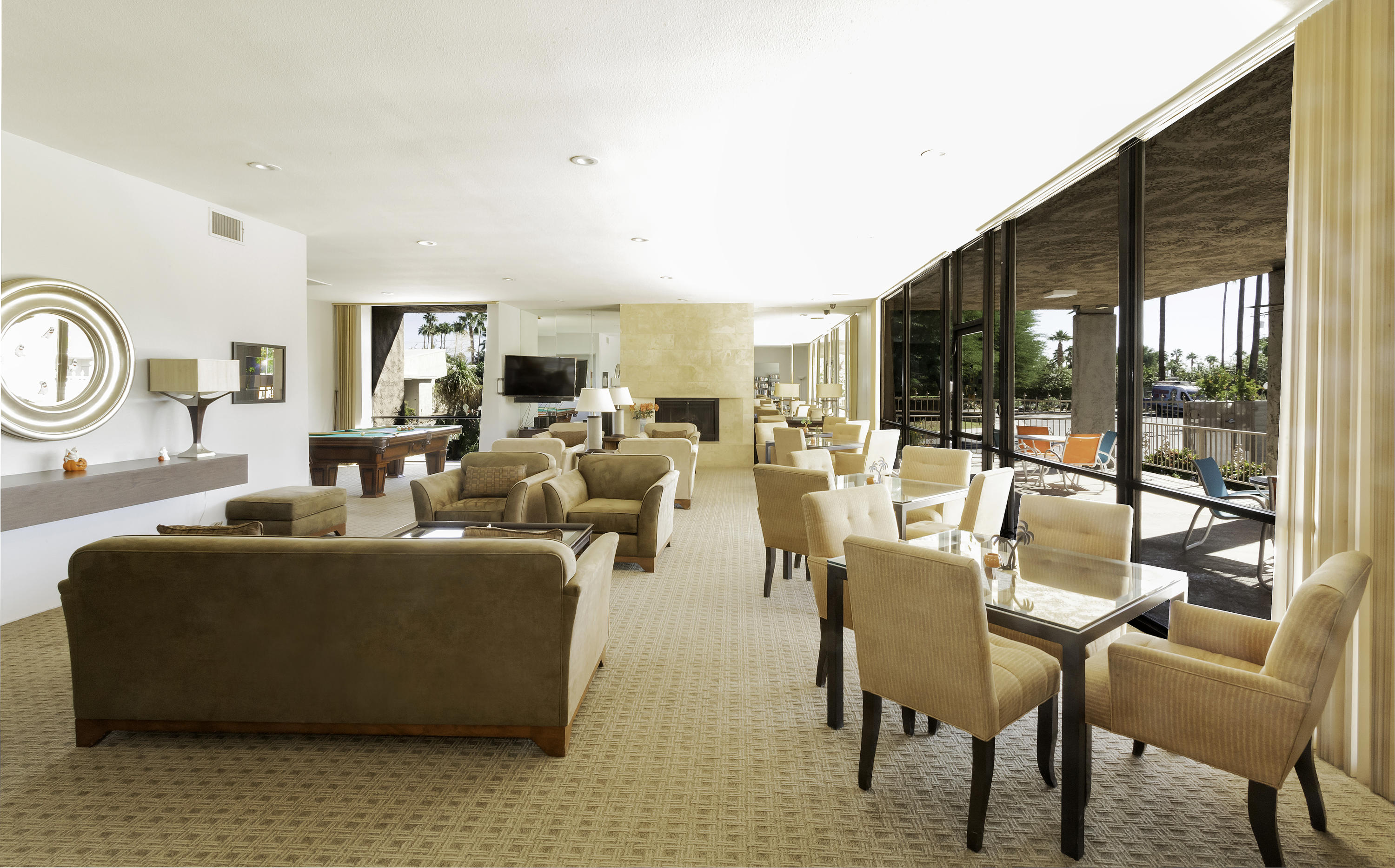 1111 Ramon Road, Unit 88 Palm Springs, CA 92264 - Photo 22 of 24 a living room with furniture and a floor to ceiling window