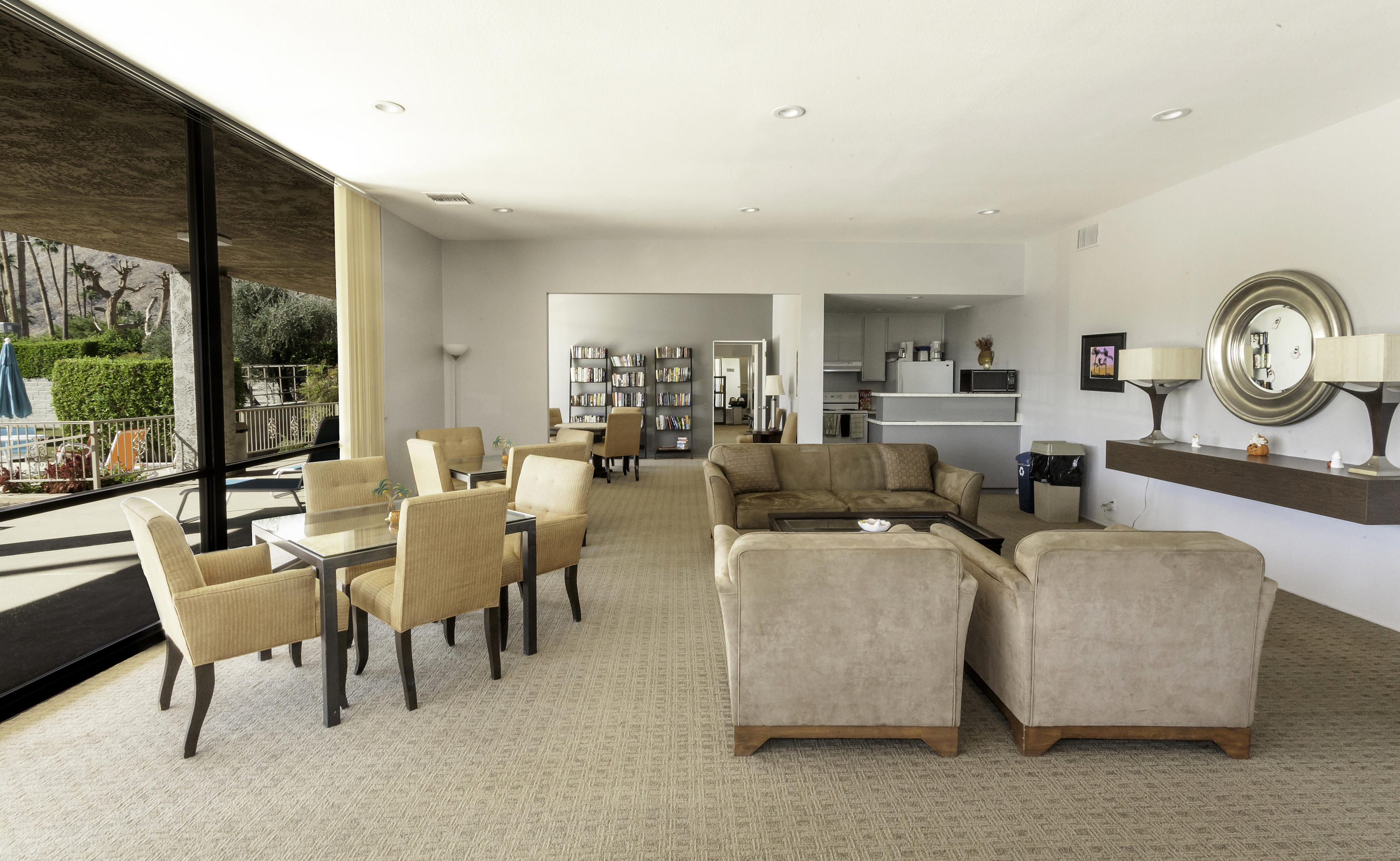 1111 Ramon Road, Unit 88 Palm Springs, CA 92264 - Photo 24 of 24 a living room with lots of furniture and a large window