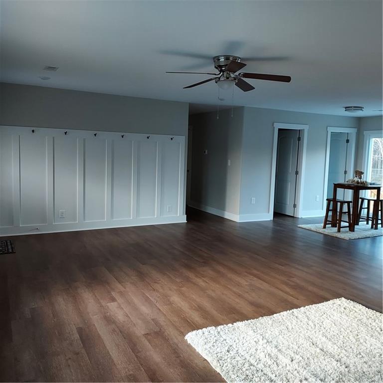 5601 Medlin Road Monroe, NC 28112 - Photo 14 of 29 a view of a livingroom with wooden floor
