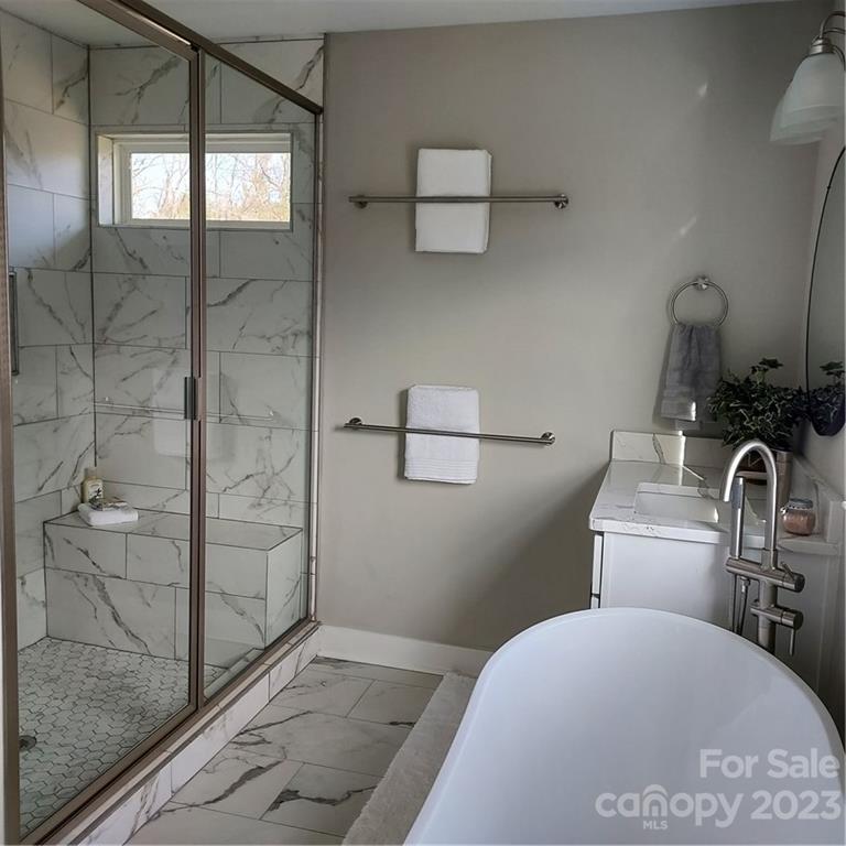 5601 Medlin Road Monroe, NC 28112 - Photo 18 of 29 a bathroom with a sink and a shower