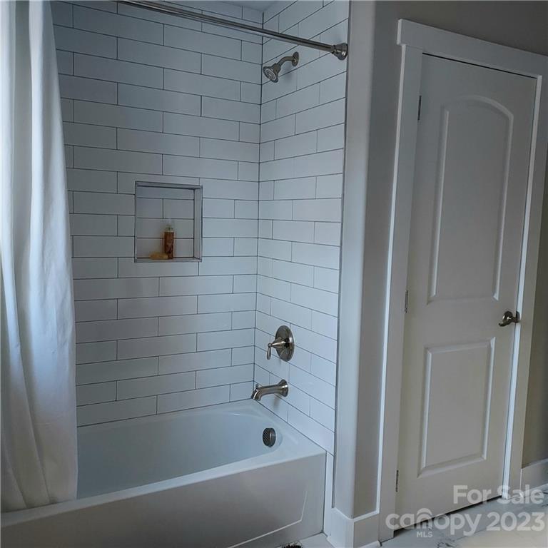 5601 Medlin Road Monroe, NC 28112 - Photo 23 of 29 a bathroom with a bathtub