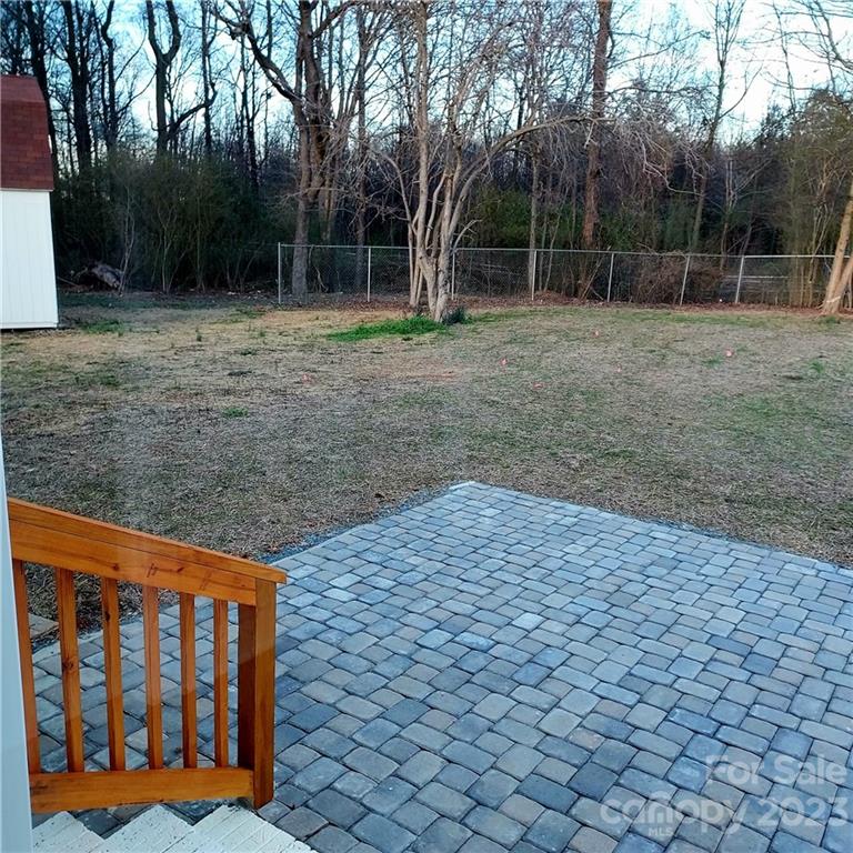 5601 Medlin Road Monroe, NC 28112 - Photo 29 of 29 a backyard of a house with lots of green space