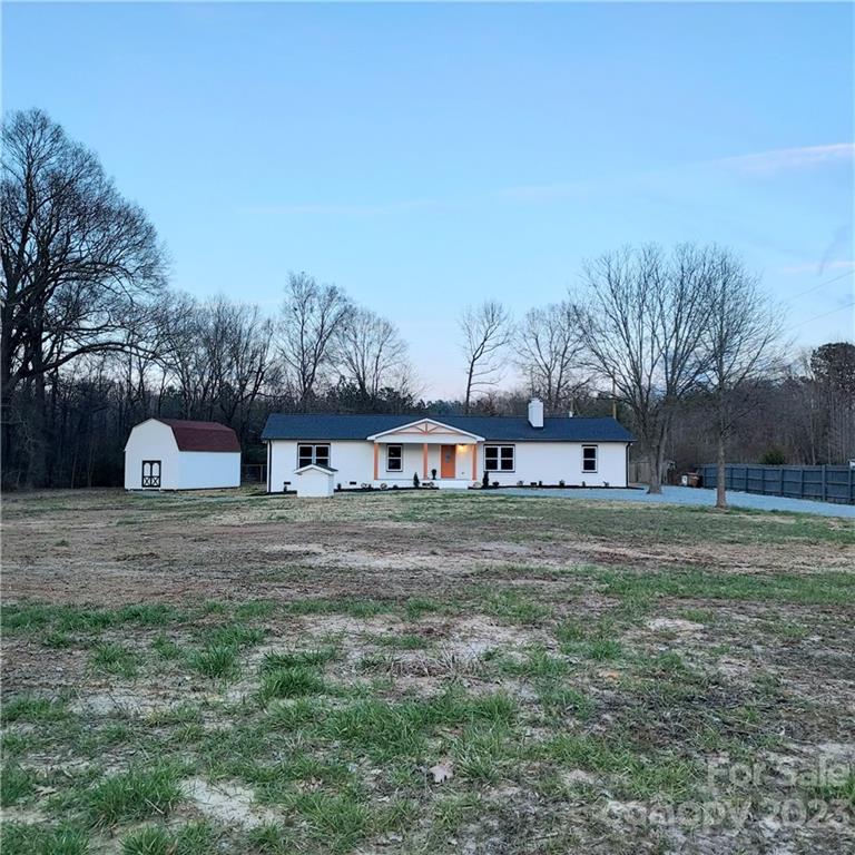 5601 Medlin Road Monroe, NC 28112 - Photo 3 of 29 a front view of house with yard and trees