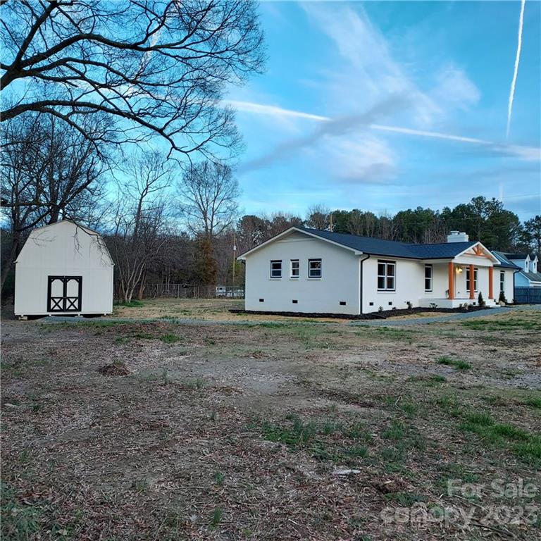5601 Medlin Road Monroe, NC 28112 - Photo 5 of 29 a view of a house with a yard
