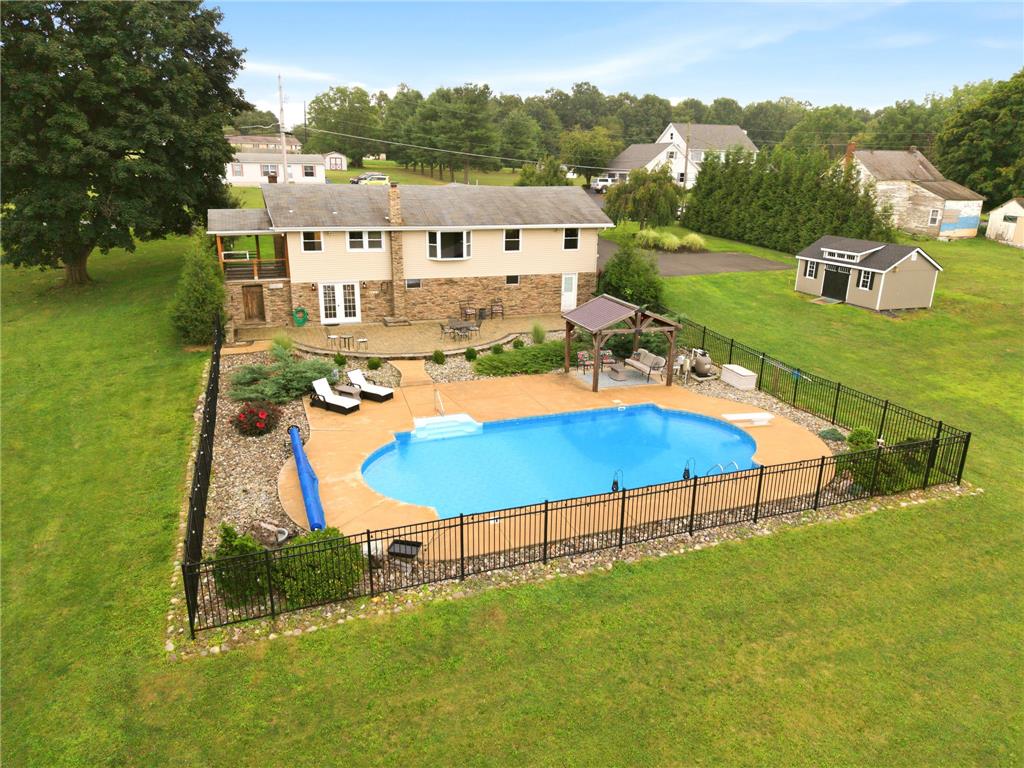 463 North Penn Dixie Road Bath, PA 18014 - Photo 78 of 86 An inviting in-ground pool and patio area await, perfect for outdoor entertaining.