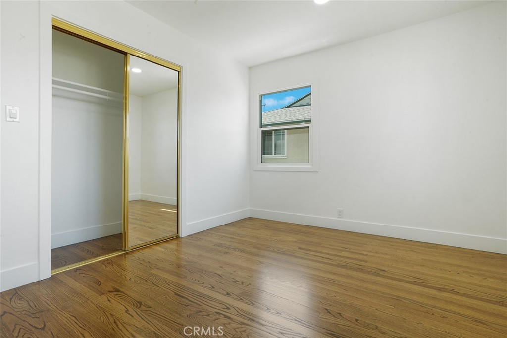 5626 Lenore Avenue Arcadia, CA 91006 - Photo 14 of 23 an empty room with wooden floor and windows