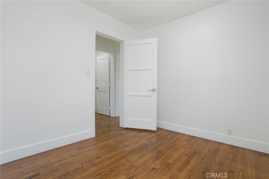 5626 Lenore Avenue Arcadia, CA 91006 - Photo 16 of 23 an empty room with wooden floor and closet