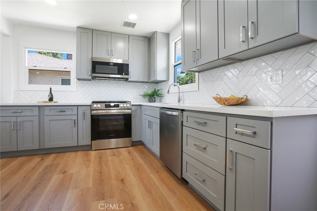 5626 Lenore Avenue Arcadia, CA 91006 - Photo 5 of 23 a kitchen with stainless steel appliances granite countertop a sink and cabinets