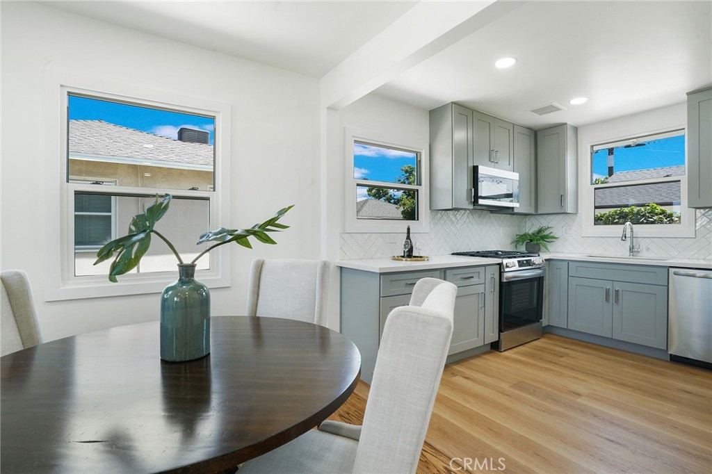 5626 Lenore Avenue Arcadia, CA 91006 - Photo 6 of 23 a kitchen with stainless steel appliances granite countertop a sink a stove top oven a counter space and cabinets