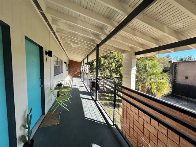 a view of balcony with furniture