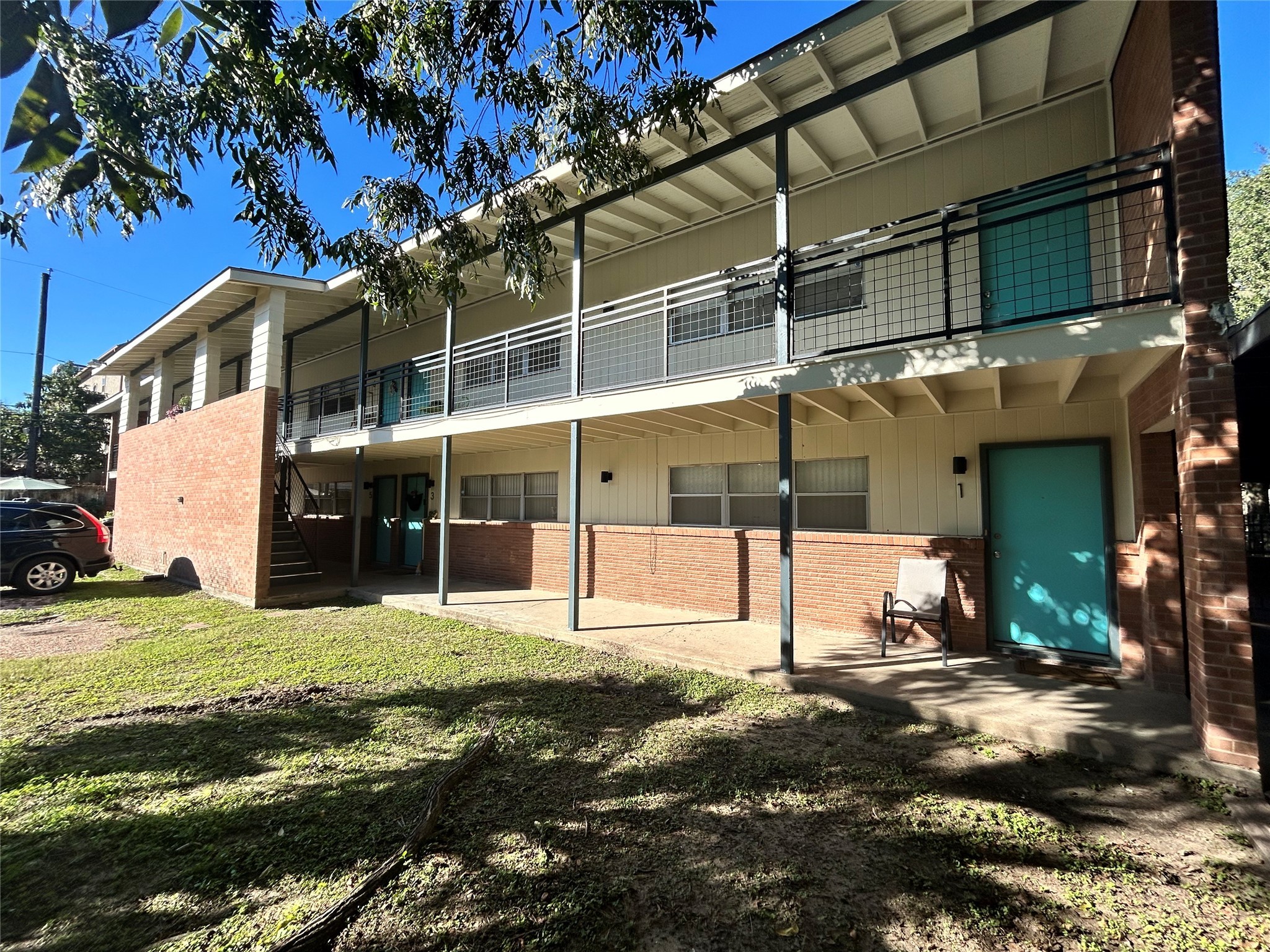 3520 Garrott Street, Unit 2 Houston, TX 77006 - Photo 13 of 14 a view of a house with a yard