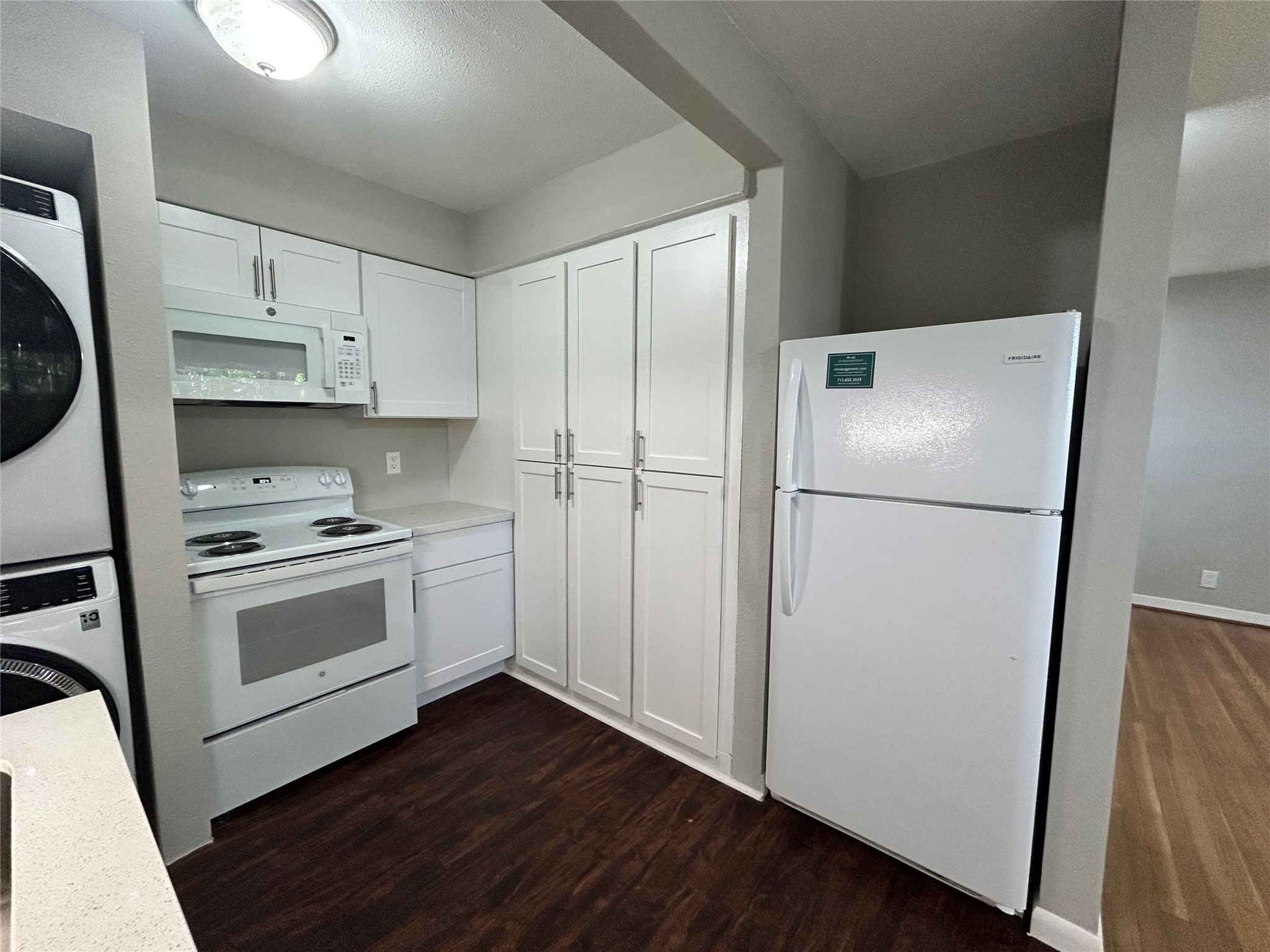3520 Garrott Street, Unit 2 Houston, TX 77006 - Photo 2 of 14 a kitchen with a refrigerator sink and cabinets