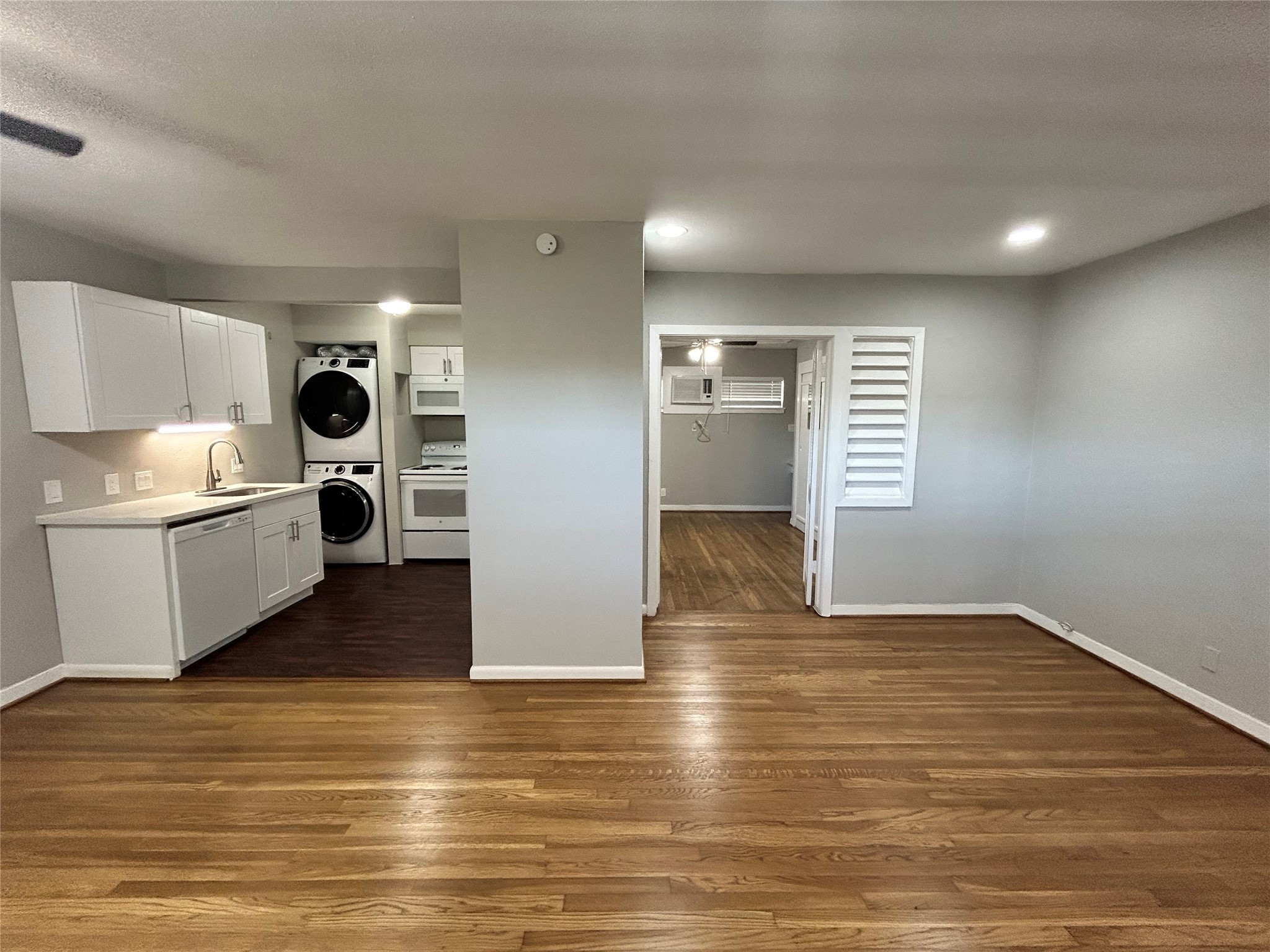 3520 Garrott Street, Unit 2 Houston, TX 77006 - Photo 4 of 14 a view of kitchen and hall with wooden floor