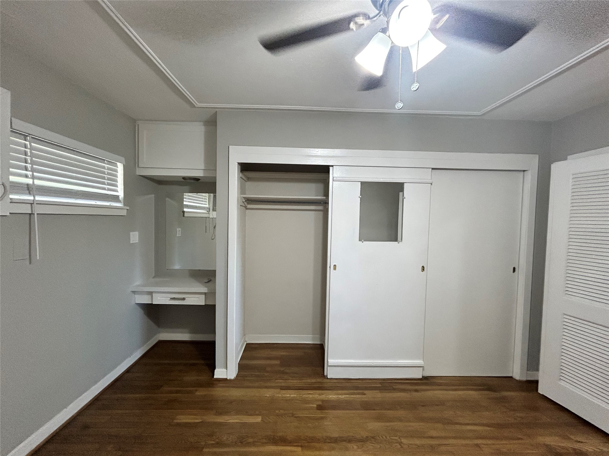 3520 Garrott Street, Unit 2 Houston, TX 77006 - Photo 8 of 14 wooden floor in an empty room with a window
