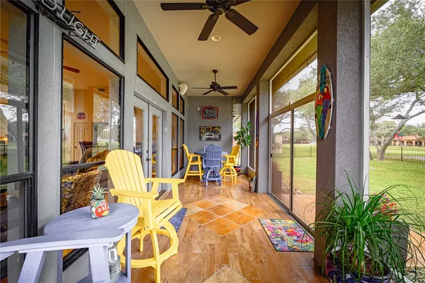 a view of a house with backyard and a tree