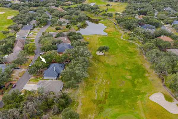a aerial view of a house with a yard