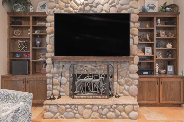 a view of fireplace and living room
