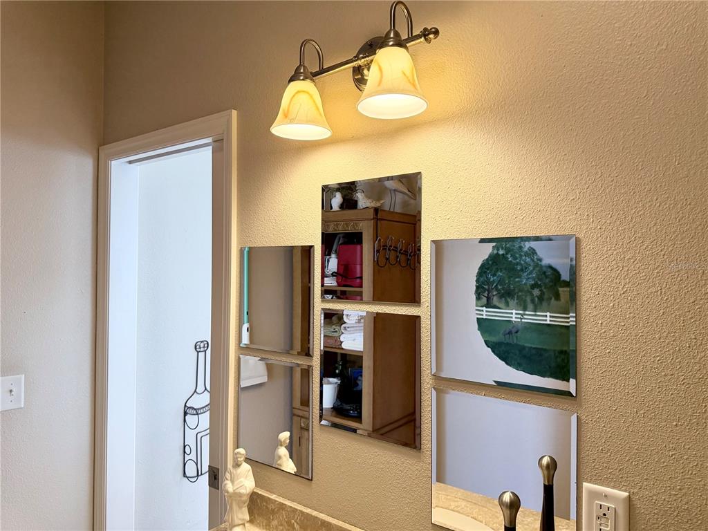 9588 Southeast 47th Way Webster, FL 33597 - Photo 24 of 43 a view of a bathroom with a tub and shower