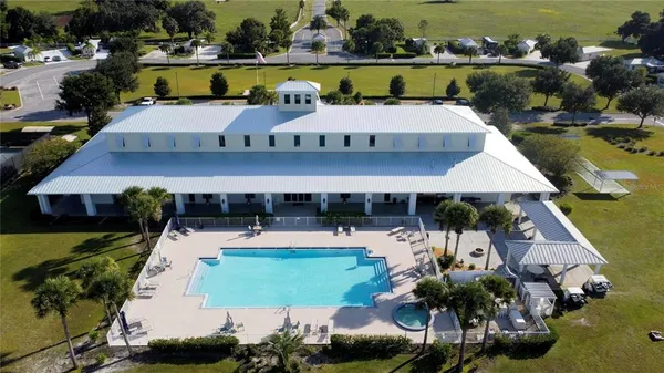 an aerial view of a house with garden space and street view