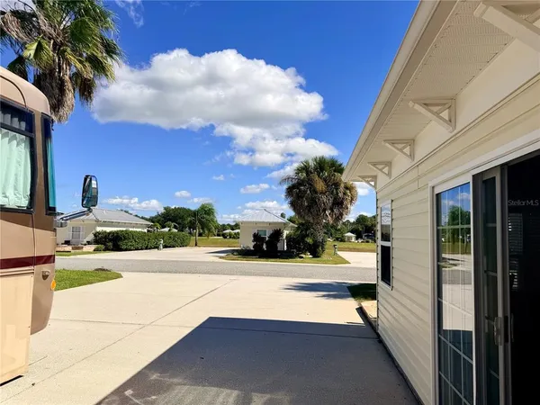 a view of a street with a building in the background
