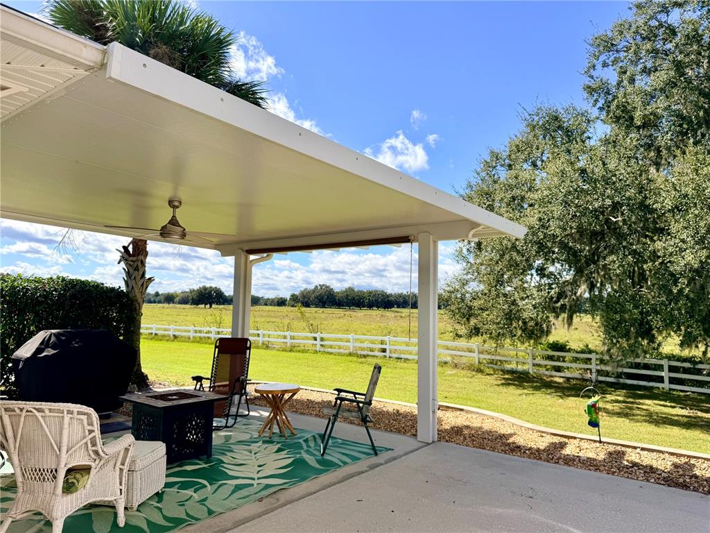 9588 Southeast 47th Way Webster, FL 33597 - Photo 8 of 43 a view of swimming pool with outdoor seating space