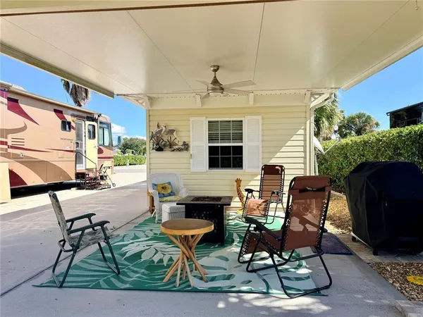 a view of a livingroom with furniture and a fireplace