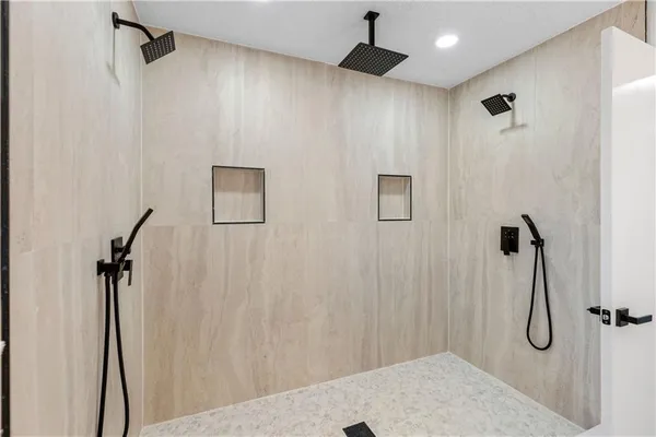 a bathroom with a shower and a shower