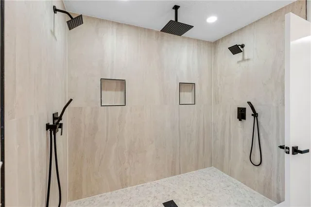 a bathroom with a shower and a shower