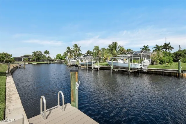 a view of a lake with boats and trees in the background