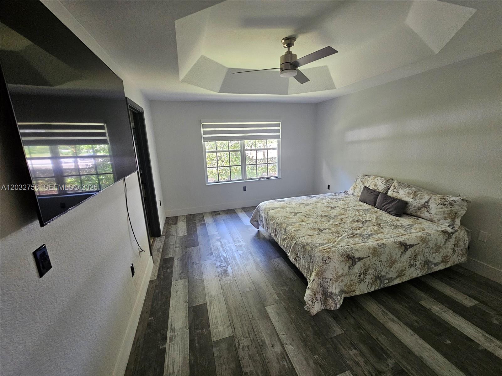 4331 Southwest 124th Way Miramar, FL 33027 - Photo 9 of 40 a bedroom with a bed and a large window