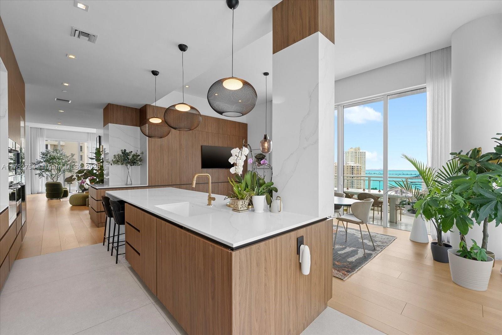 900 Brickell Key Boulevard, Unit 1604 Miami, FL 33131 - Photo 12 of 49 a view of a living room and dining room