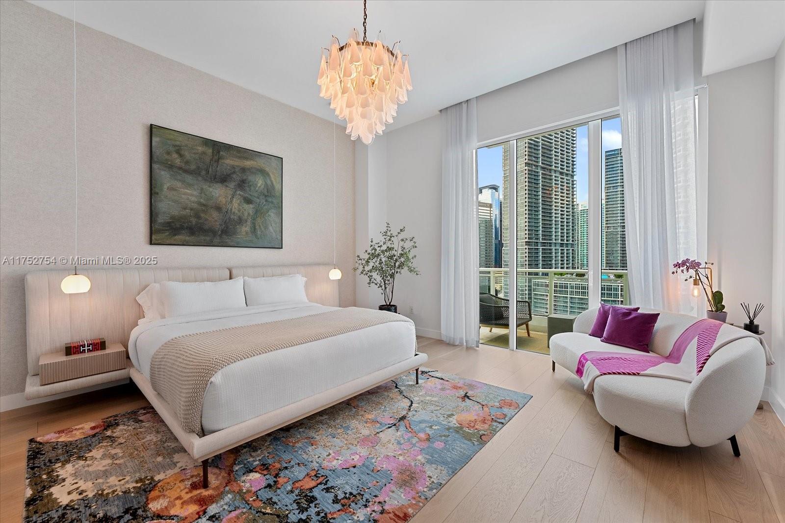 900 Brickell Key Boulevard, Unit 1604 Miami, FL 33131 - Photo 17 of 49 a spacious bedroom with a large bed and a couch