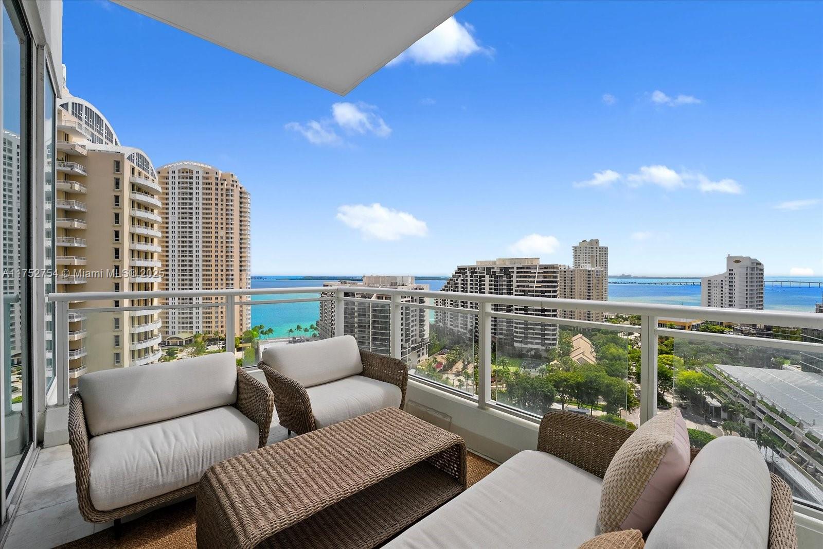 900 Brickell Key Boulevard, Unit 1604 Miami, FL 33131 - Photo 2 of 49 a balcony with furniture and a roof