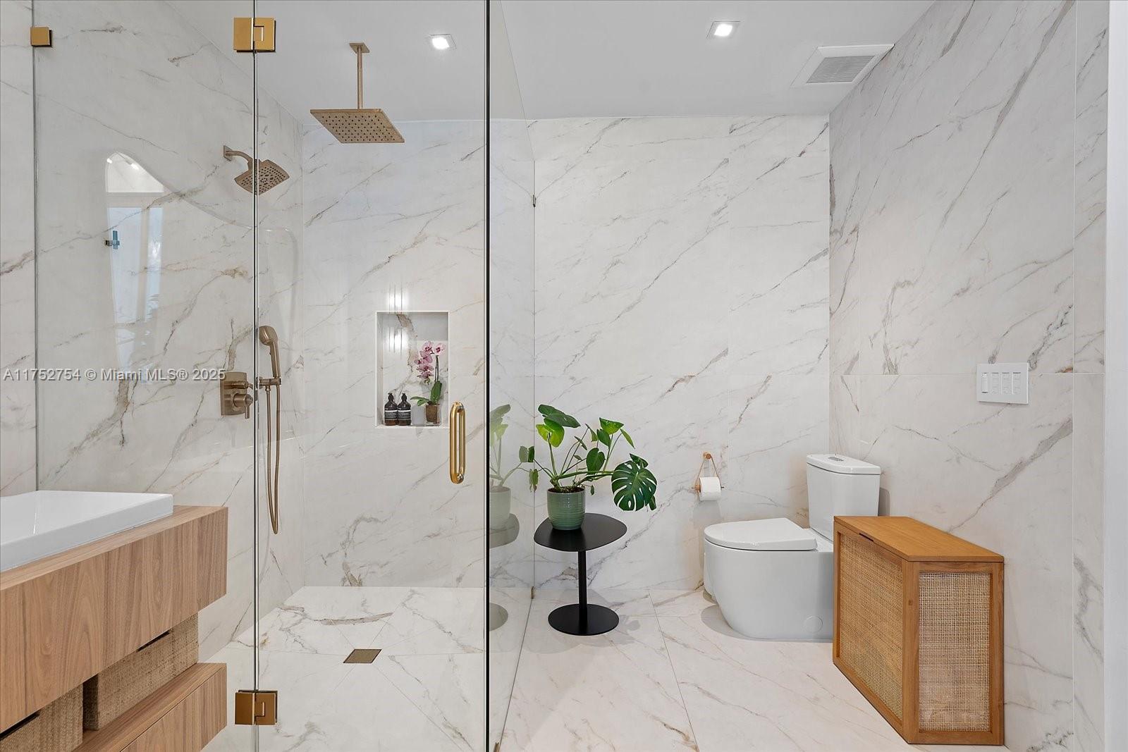 900 Brickell Key Boulevard, Unit 1604 Miami, FL 33131 - Photo 21 of 49 a white bath tub sitting next to a white toilet