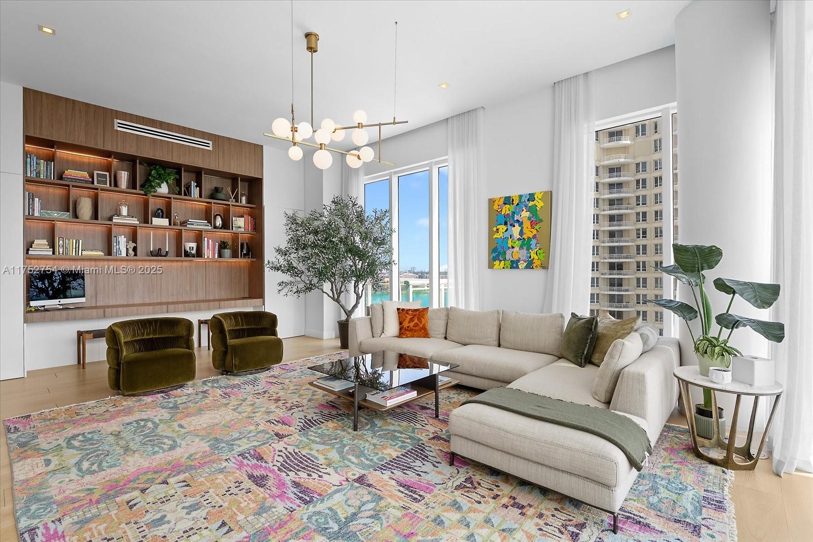 900 Brickell Key Boulevard, Unit 1604 Miami, FL 33131 - Photo 4 of 49 a living room with furniture and a fireplace