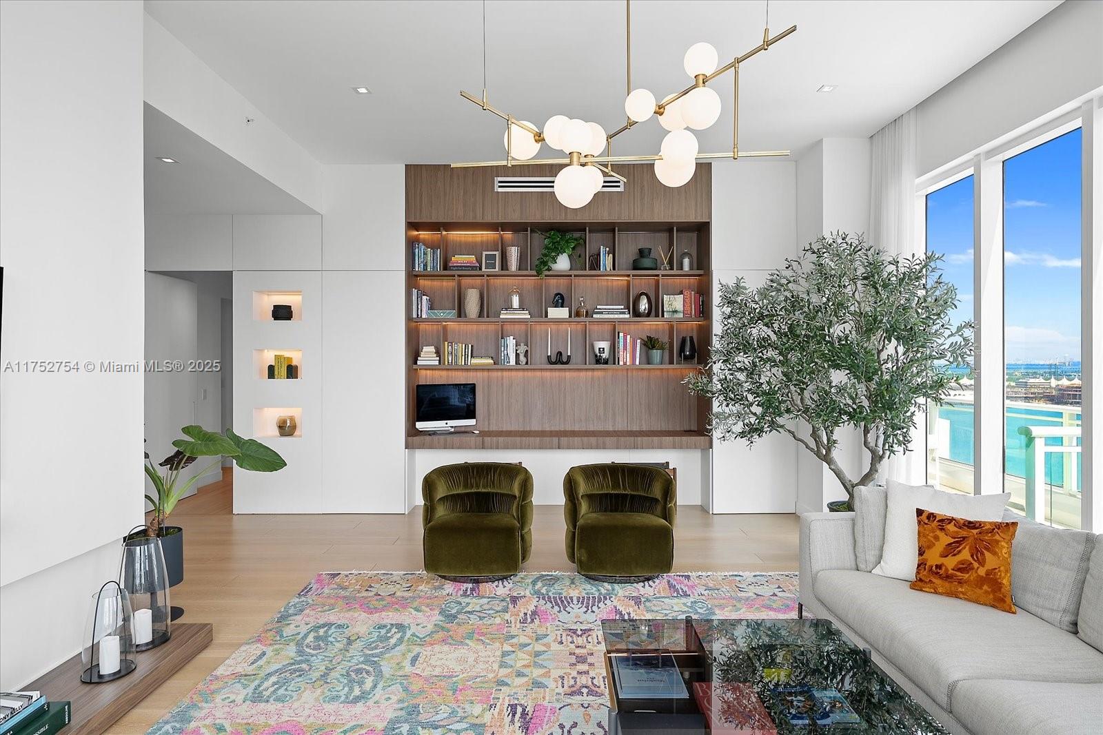 900 Brickell Key Boulevard, Unit 1604 Miami, FL 33131 - Photo 5 of 49 a living room with fireplace furniture and a potted plant