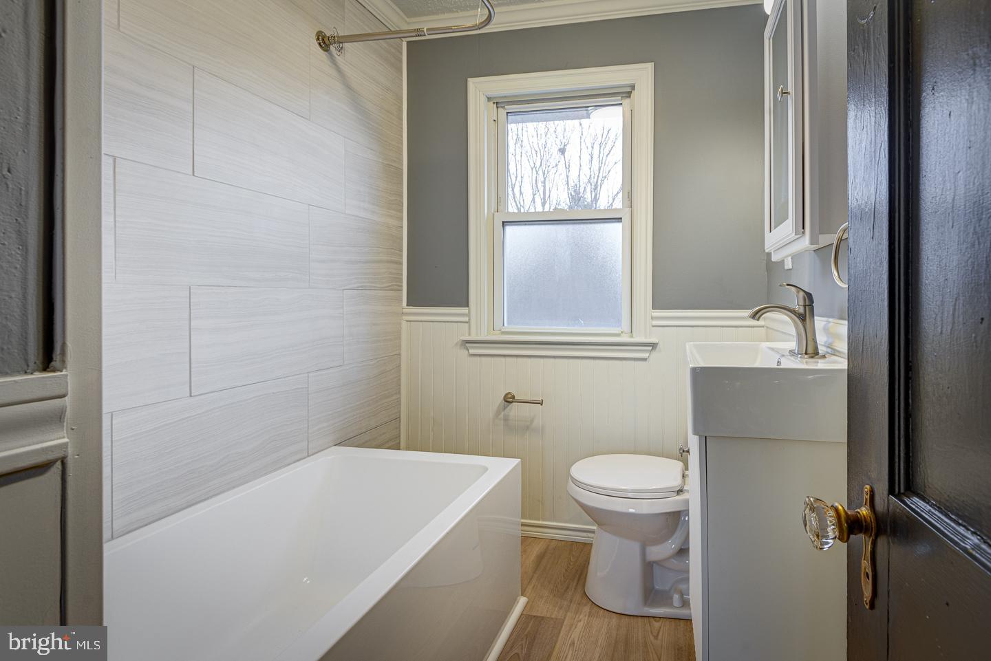 1363 Maple Avenue Croydon, PA 19021 - Photo 19 of 29 a bathroom with a sink a toilet and a window
